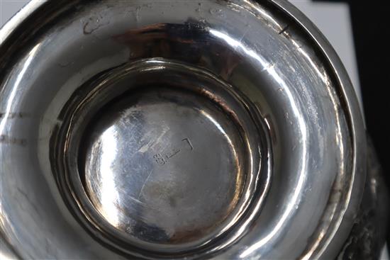 An early 20th century Chinese white metal pedestal bowl, embossed with dragons, 13.5 oz.